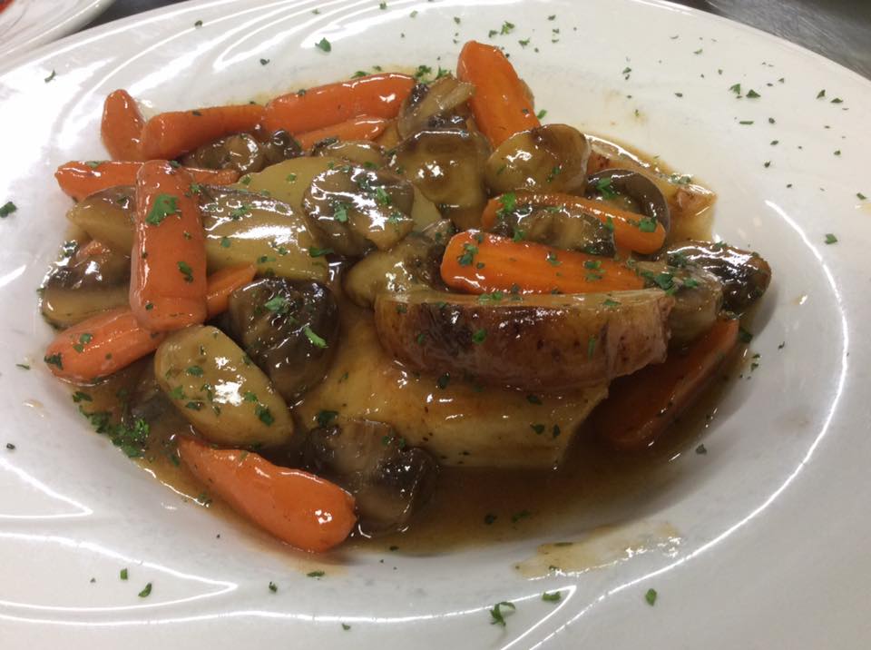 Braised entrée with roasted carrots and mushrooms